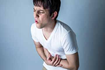 young man having a stomachache