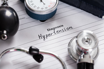 Text Diagnosis Hypertension;Stethoscope And Blood Pressure Gauge