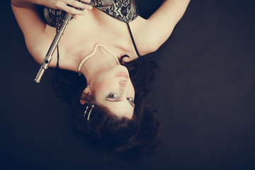 Elegant woman with flute instrument. © anetlanda