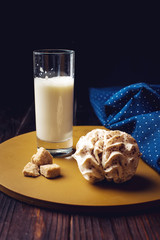 glass of milk standing on a wooden table