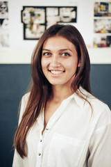Fototapeta premium Casual business woman looking happy and smiling