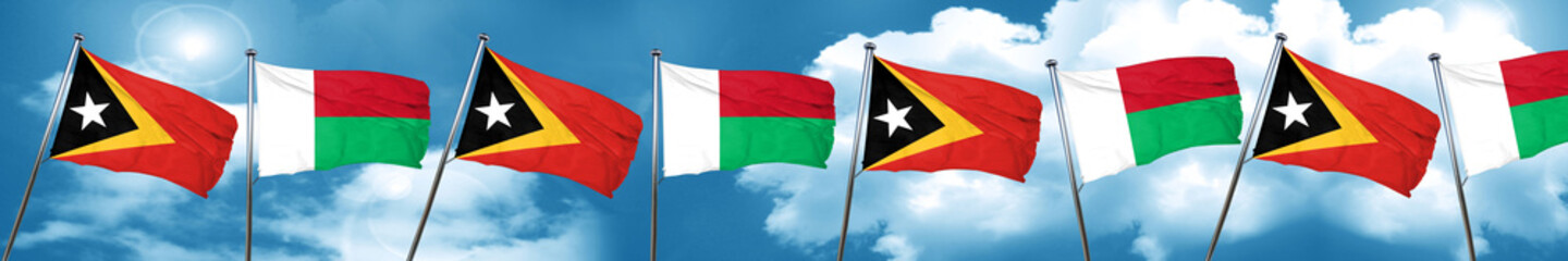 east timor flag with Madagascar flag, 3D rendering