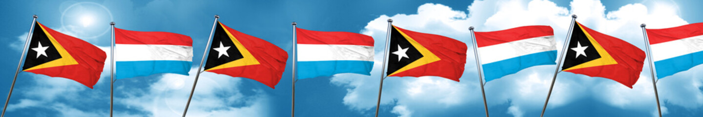 east timor flag with Luxembourg flag, 3D rendering