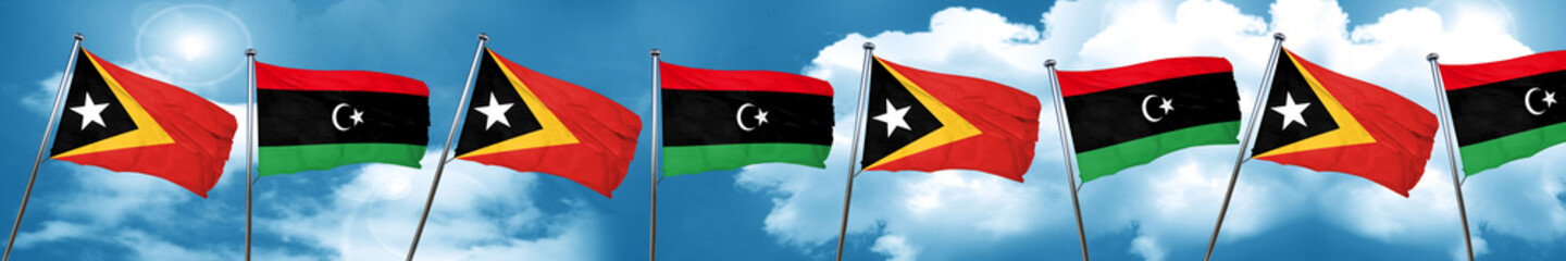 east timor flag with Libya flag, 3D rendering