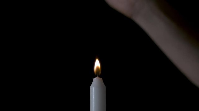 Slow-motion of Candle Relit from Smoke
