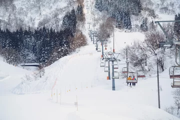 Fotobehang skii lift at snow resort in Yuzawa © SewcreamStudio