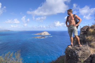 Hiker on top of mountain in Hawaii