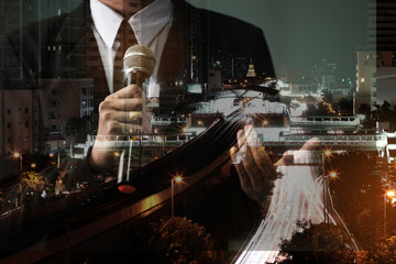 Double exposure of success businessman speech with microphone on