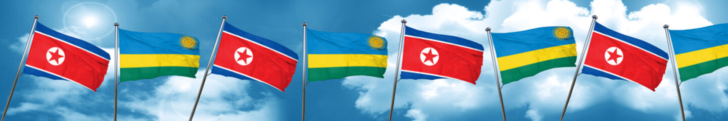 North Korea flag with rwanda flag, 3D rendering
