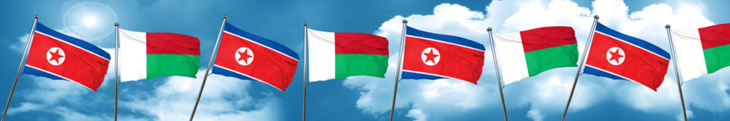 North Korea flag with Madagascar flag, 3D rendering