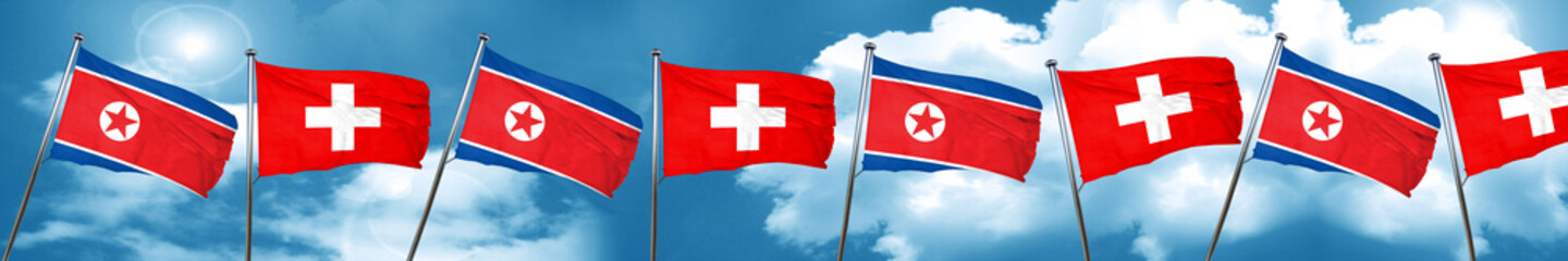 North Korea flag with Switzerland flag, 3D rendering