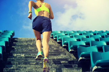 healthy lifestyle young fitness woman running on stairs