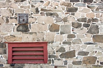 Stone Wall with Red Grate