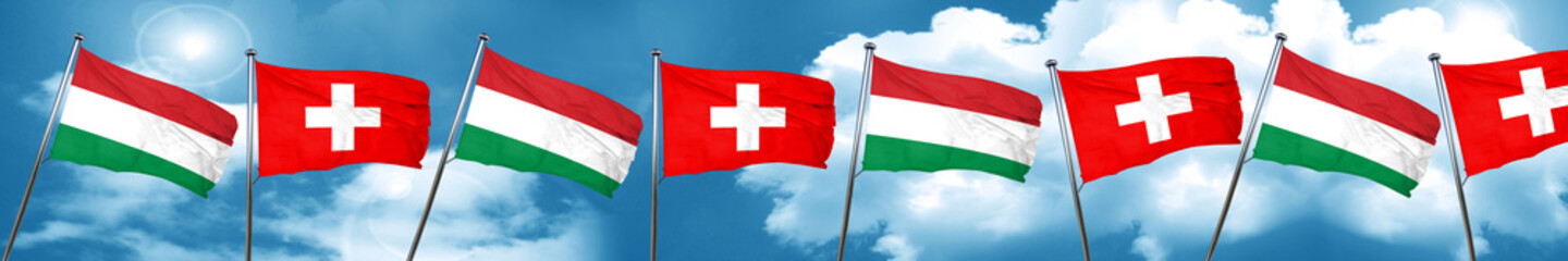Hungary flag with Switzerland flag, 3D rendering