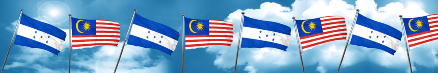 Honduras flag with Malaysia flag, 3D rendering