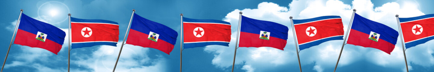 Haiti flag with North Korea flag, 3D rendering