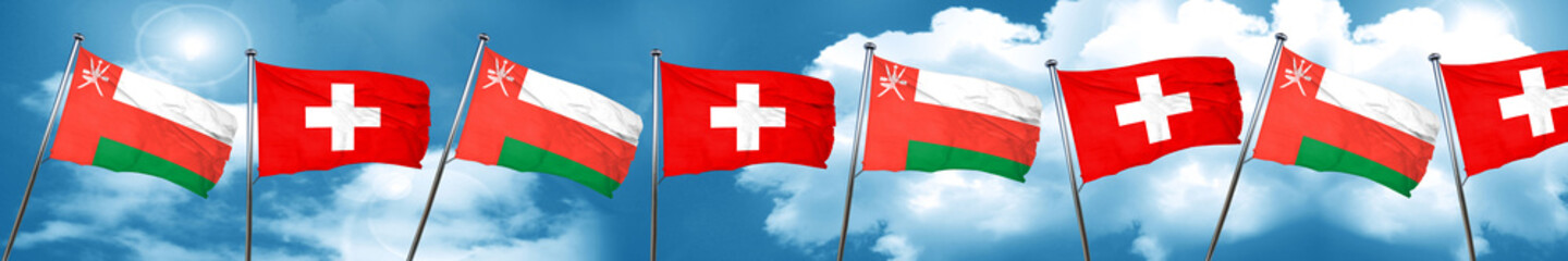 Oman flag with Switzerland flag, 3D rendering