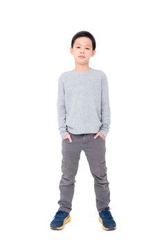 Young asian boy standing over white background