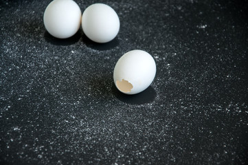 Eggs over black background