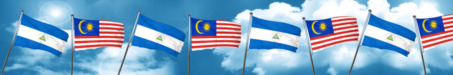 nicaragua flag with Malaysia flag, 3D rendering