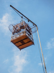 Bird cage hang on a pole,blue sky background