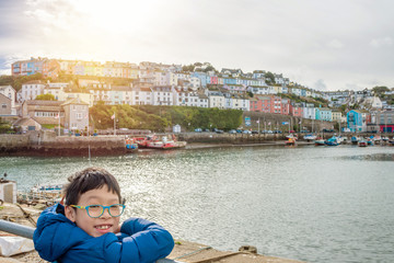 Fototapeta na wymiar Young asian boy smiling at harbor