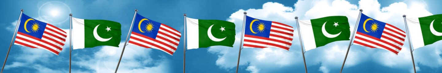 Malaysia flag with Pakistan flag, 3D rendering