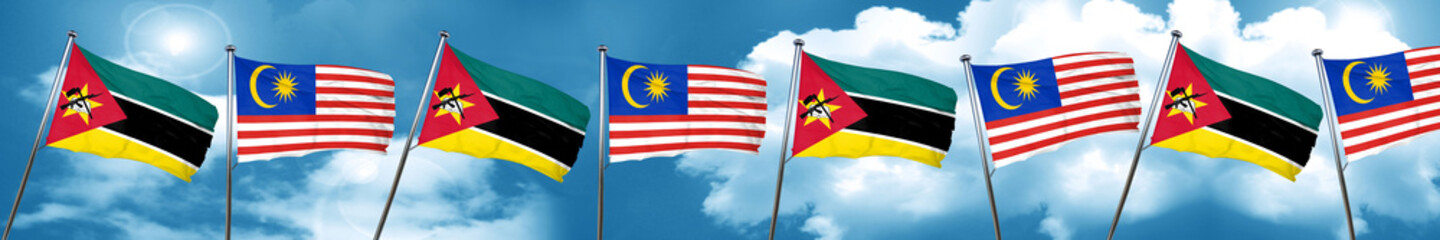 Mozambique flag with Malaysia flag, 3D rendering