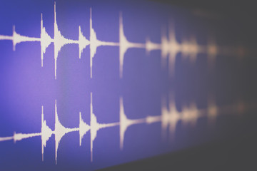 digital waveform on screen, music background. recording concept