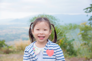 Little asian girl smiling outdoor