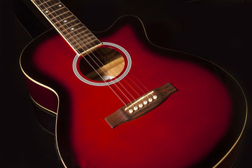 Obraz na płótnie Canvas Acoustic guitar on black background