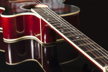 Acoustic guitar on black background - 135657930