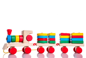 Colorful wooden train toy over white background