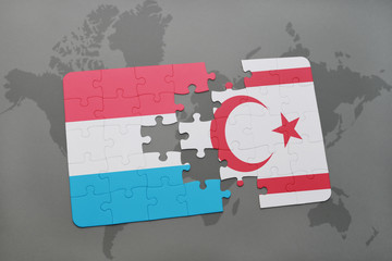 puzzle with the national flag of luxembourg and northern cyprus on a world map