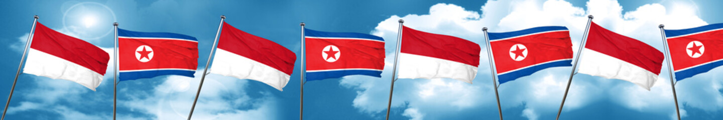 monaco flag with North Korea flag, 3D rendering