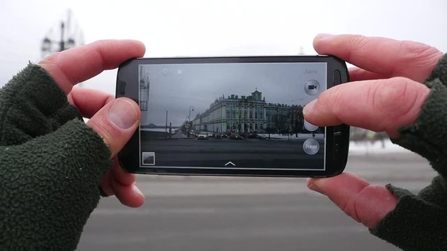 Man Taking Pictures with his Smartphone. Hermitage. Saint-Petersburg. Russia