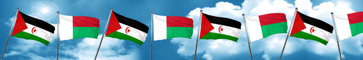 Western sahara flag with Madagascar flag, 3D rendering