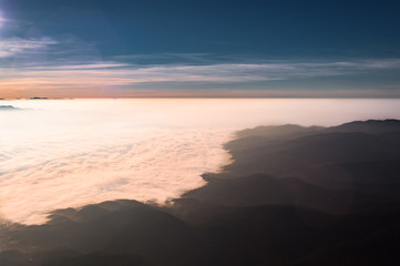 Sea of clouds flow over mountains with scenery view