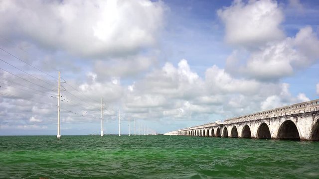 Electric power lines in ocean run along Seven Mile Bridge in the Florida Keys
