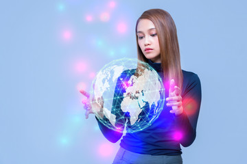 young woman looking at a abstract object floating on her hands, communication network concept.