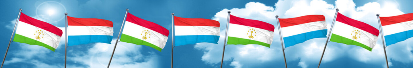 Tajikistan flag with Luxembourg flag, 3D rendering