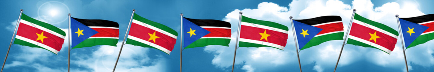Suriname flag with South Sudan flag, 3D rendering