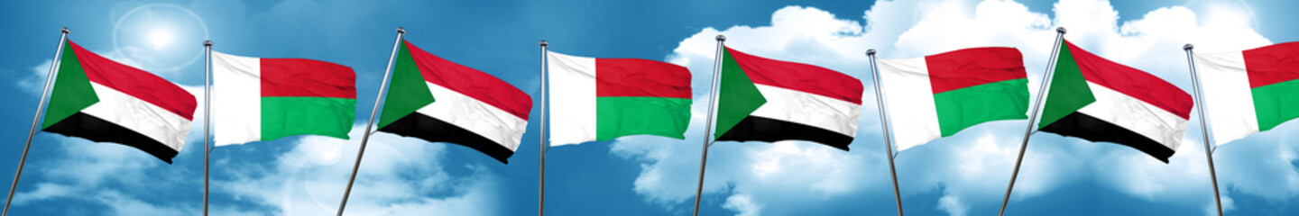 Sudan flag with Madagascar flag, 3D rendering