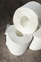 Toilet paper on wood background