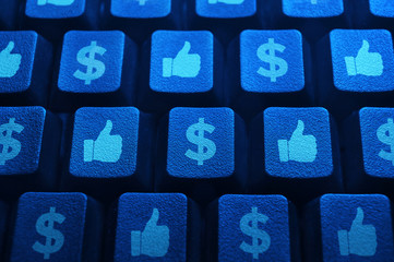 Make money with social media, money icon and like button on computer keyboard