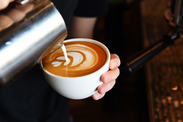 cup of latte art coffee for background