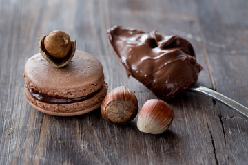Chocolate macarons on a rustic wooden table