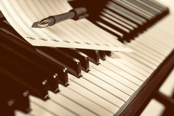 music notes on piano keys