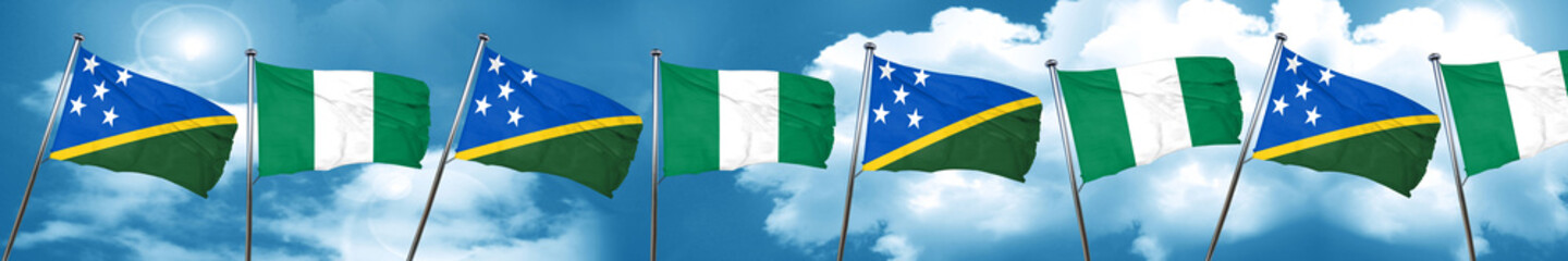 Solomon islands flag with Nigeria flag, 3D rendering