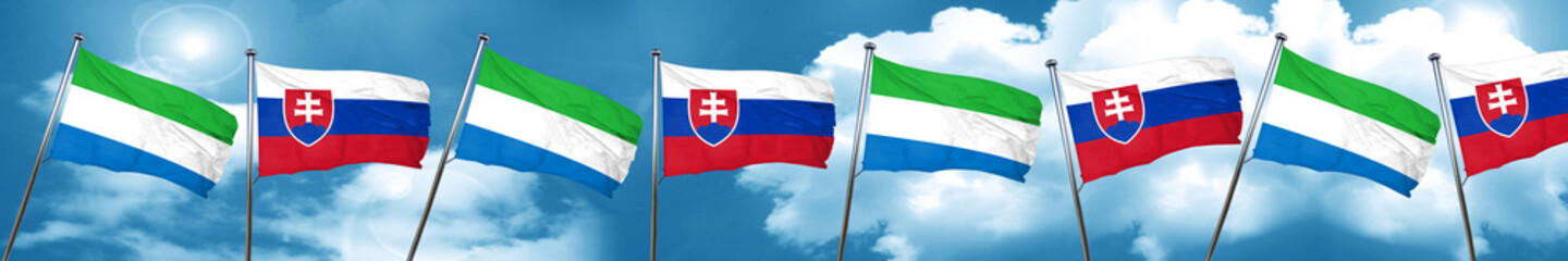 Sierra Leone flag with Slovakia flag, 3D rendering